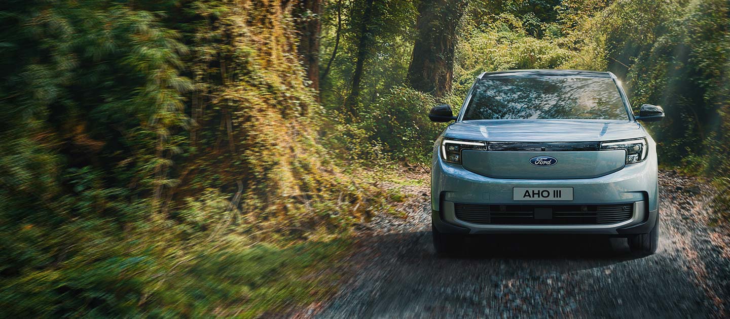 A front view of Ford Explorer® driving through a jungle